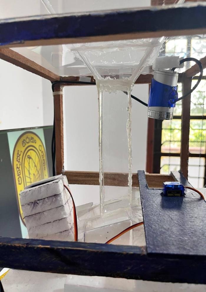 Close view of the coin tube, holder, and servo-supported mechanism