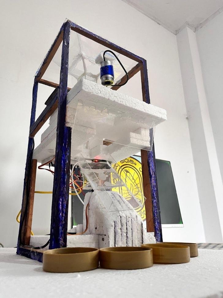 Angled view of the complete coin sorter and its collection bins