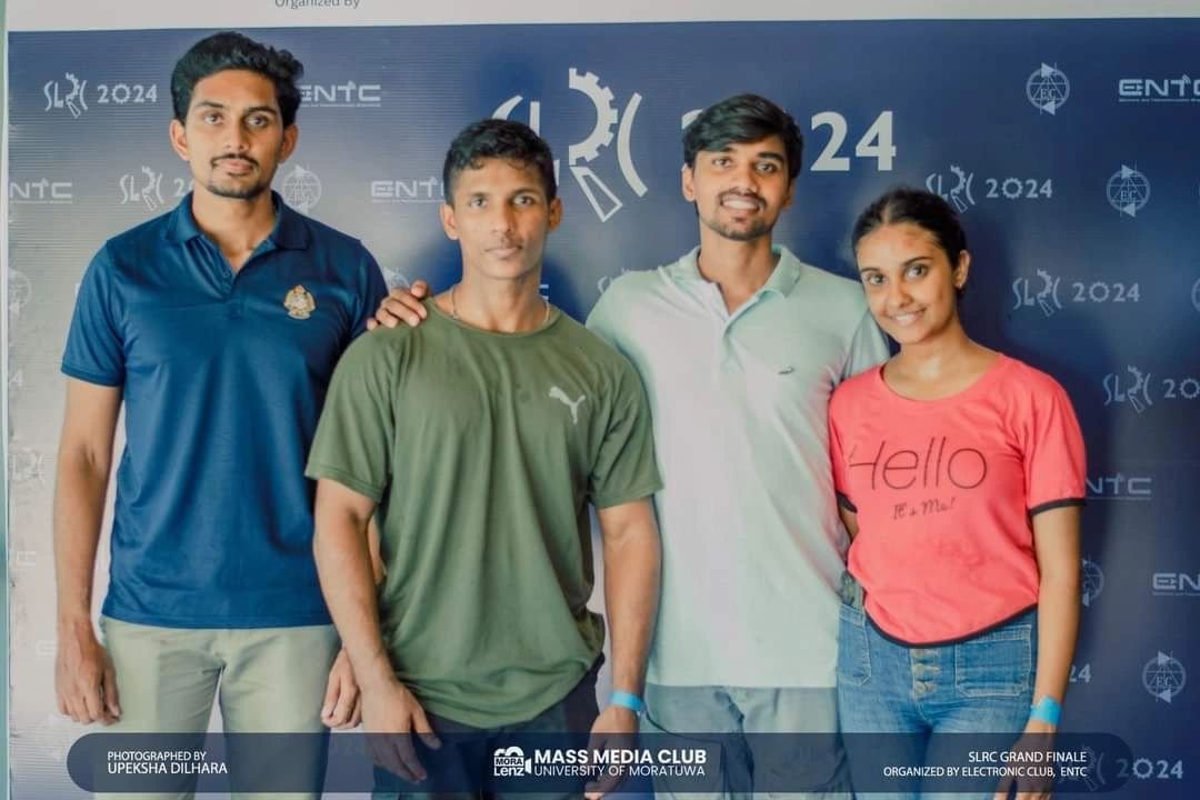 Four members of Team Panthera in front of the SLRC 2024 backdrop
